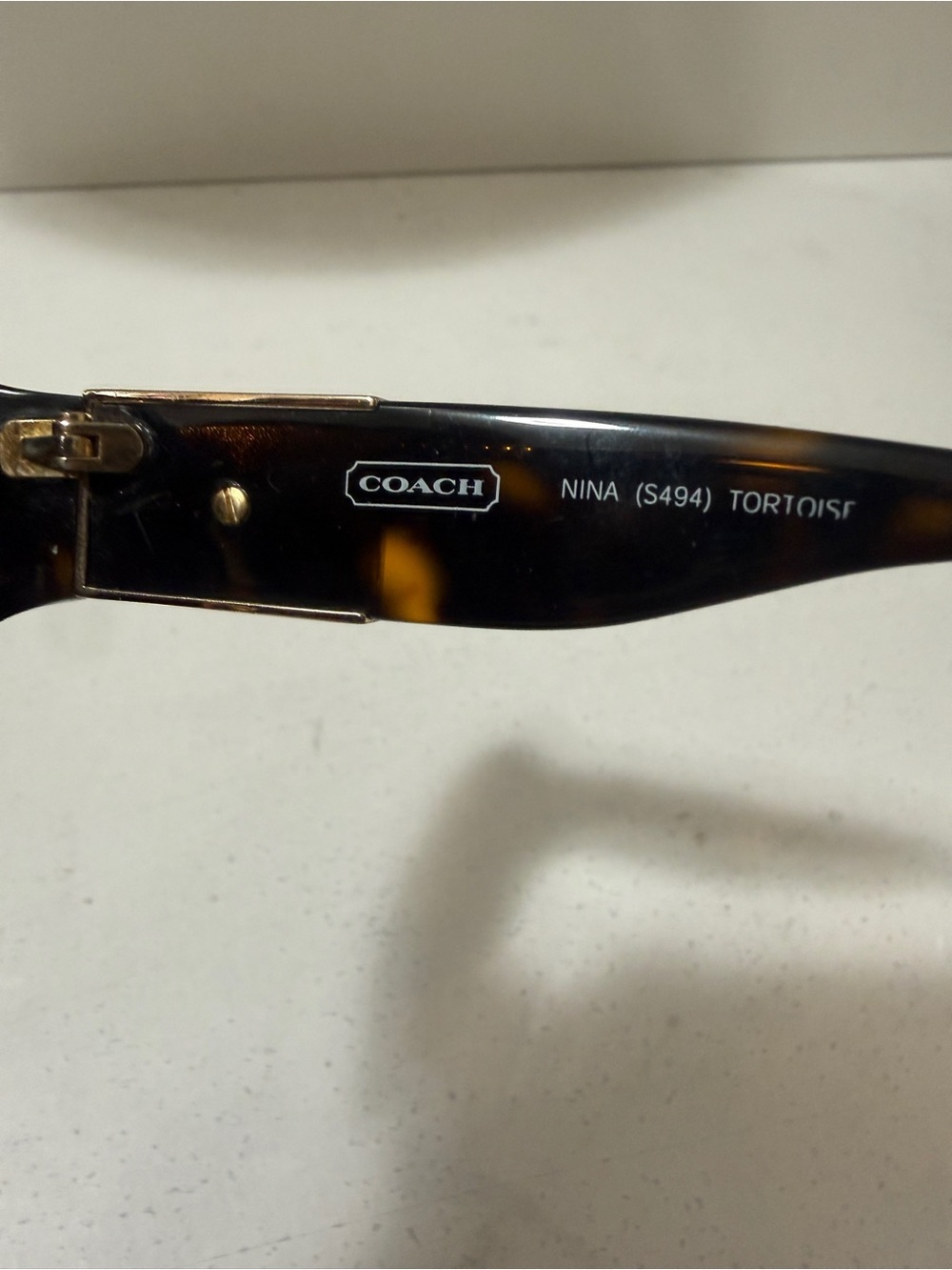 Coach Nina S494Tortoise Sunglasses featuring a dark brown tortoiseshell frame - Picture 16 of 16
